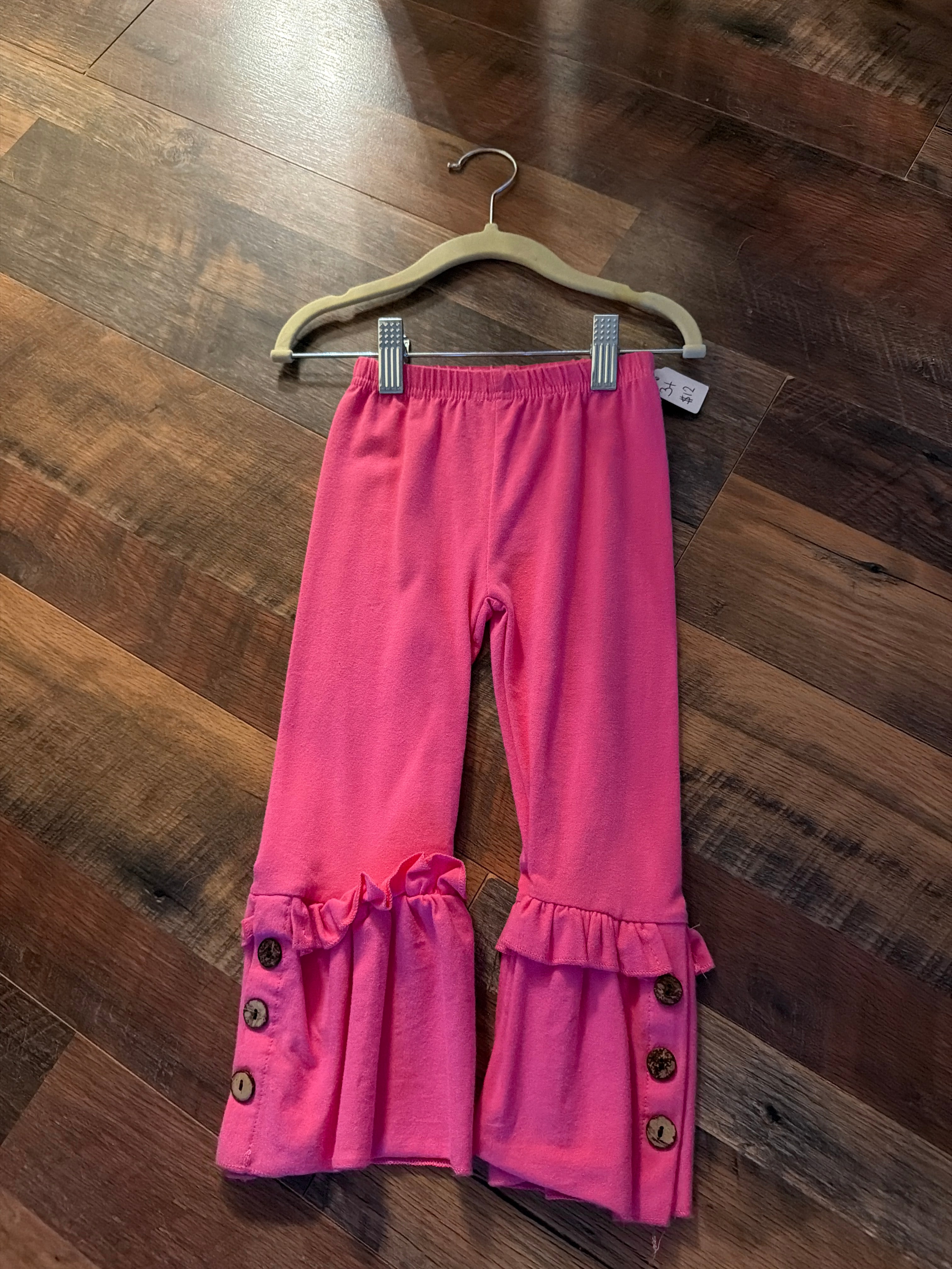 Pink ruffle button pants