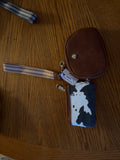 Brown cow print wristlet